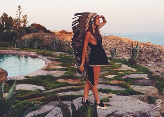 Anna Dello Russo Posts Photos Wearing a Native American Headdress