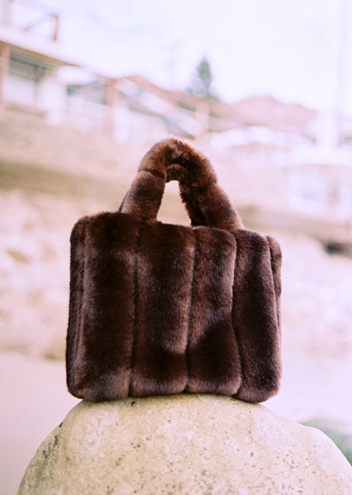 The Deneuve Bag, $150.50 (was $215); at Staud https://staud.clothing/product/2574