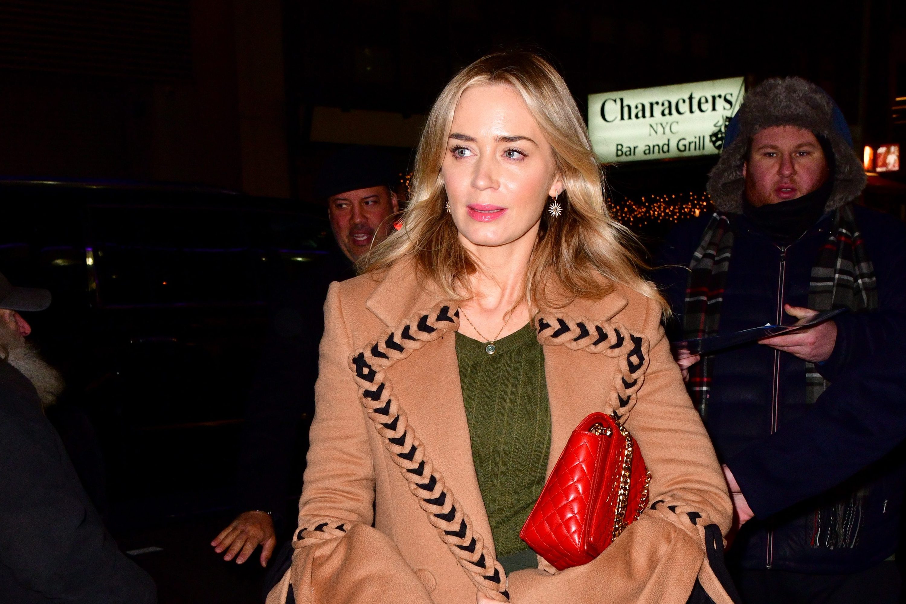 Dua Lipa Hiding In a Puffer Coat Is Relatable AF