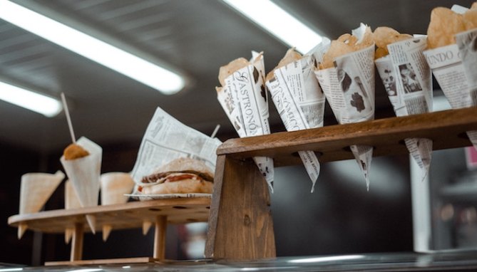 Cones of food displayed at a restaurant or food festival