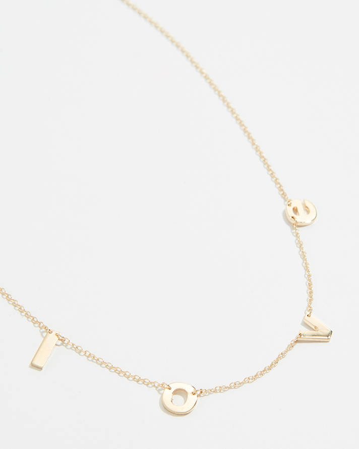 STYLECASTER | Word and Name Jewelry Is Having a Moment, Because Carrie Bradshaw Is a Forever Fashion Icon