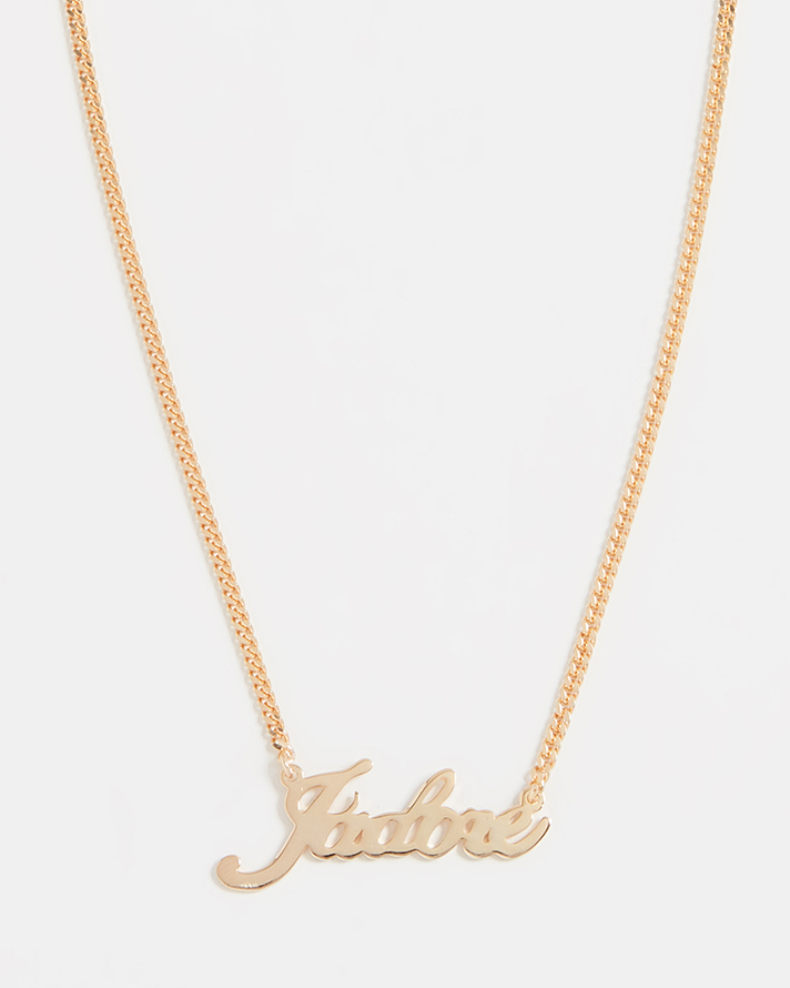 STYLECASTER | Word and Name Jewelry Is Having a Moment, Because Carrie Bradshaw Is a Forever Fashion Icon