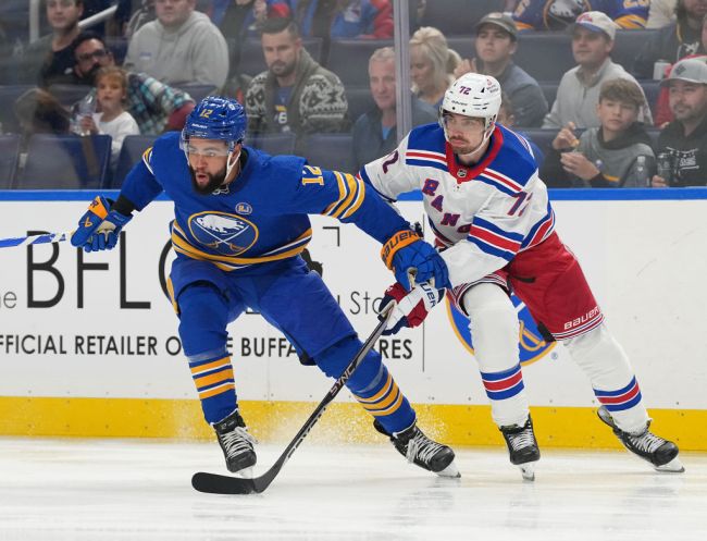 BUFFALO, NY - OCTOBER 12: Jordan Greenway #12 of the Buffalo Sabres and Filip Chytil #72 of the New York Rangers fight for position during the second period at KeyBank Center on October 12, 2023 in Buffalo, New York. 