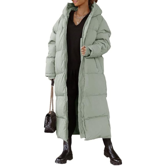 A model wearing the Shanfetl Women Long Quilted Coat Hooded in light seafoam green.