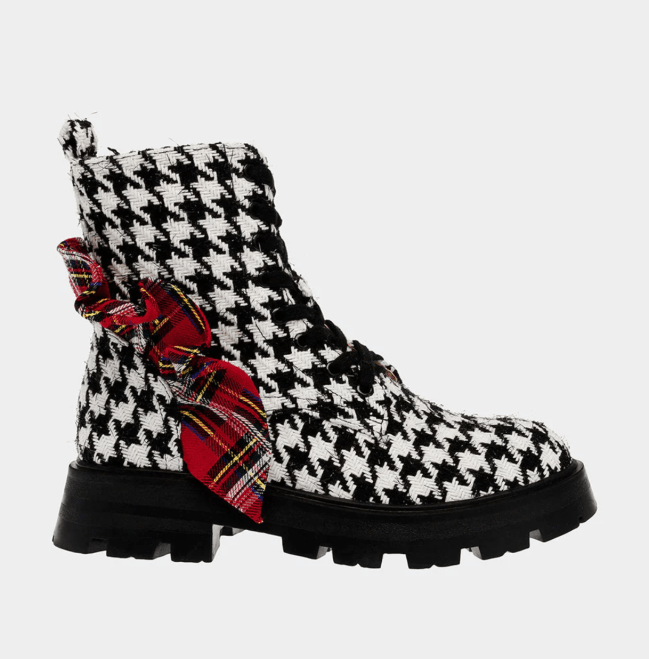 A vintage black and white houndstooth boot from Betsey Johnson