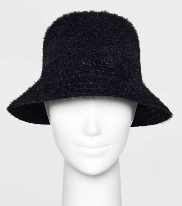 A mannequin waring a black fuzzy bucket hat from Target