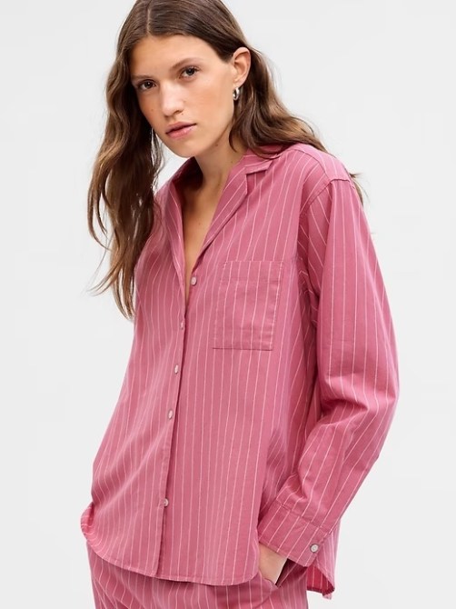 A model wearing a long-sleeve pink pajama top from Gap