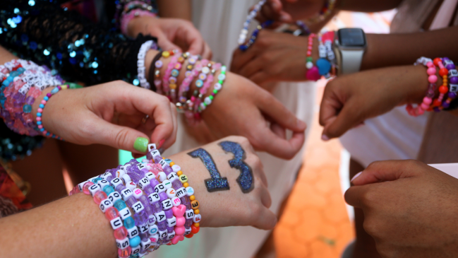 Swifties wearing friendship bracelets at the Eras Tour