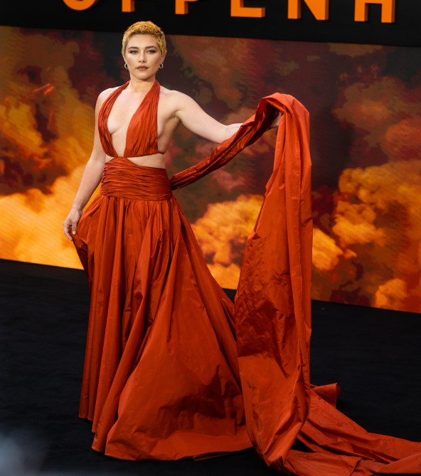 Florence Pugh in a dramatic red-orange cutout gown at the "Oppenheimer" UK premiere
