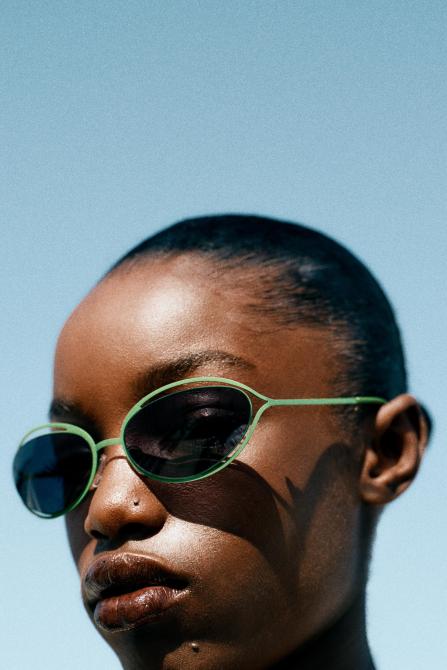 Model wearing oval sunglasses from Zara