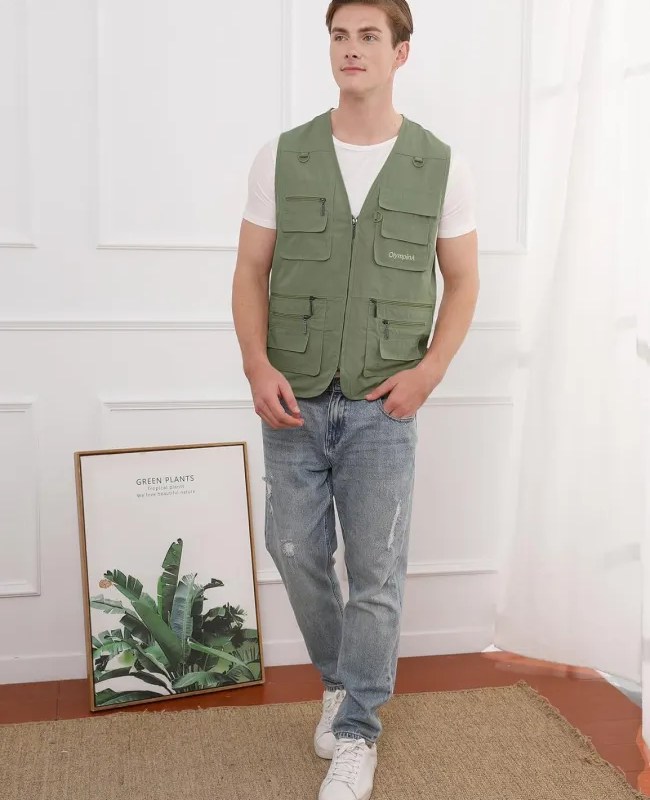 A man wearing a green fishing vest.