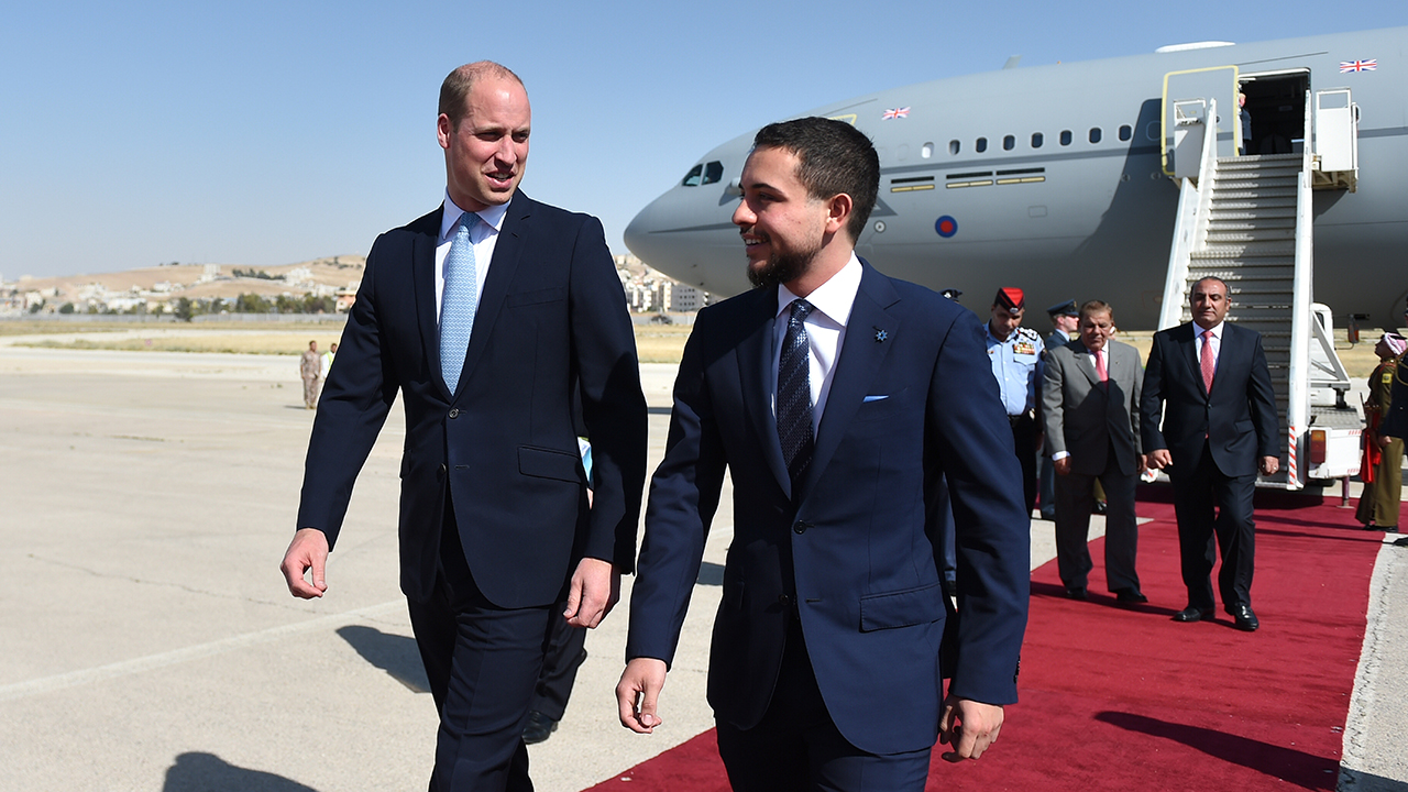 Prince William, Duke of Cambridge is greeted by the Crown Prince Hussein of Jordan (R) after arriving at Marka Airport at the start of his Middle East tour on June 24, 2018 Amman, Jordan. Prince William's five-day tour of the region is his most high-profile foreign trip and the first official visit to Palestine by a member of the monarchy on behalf of the Government