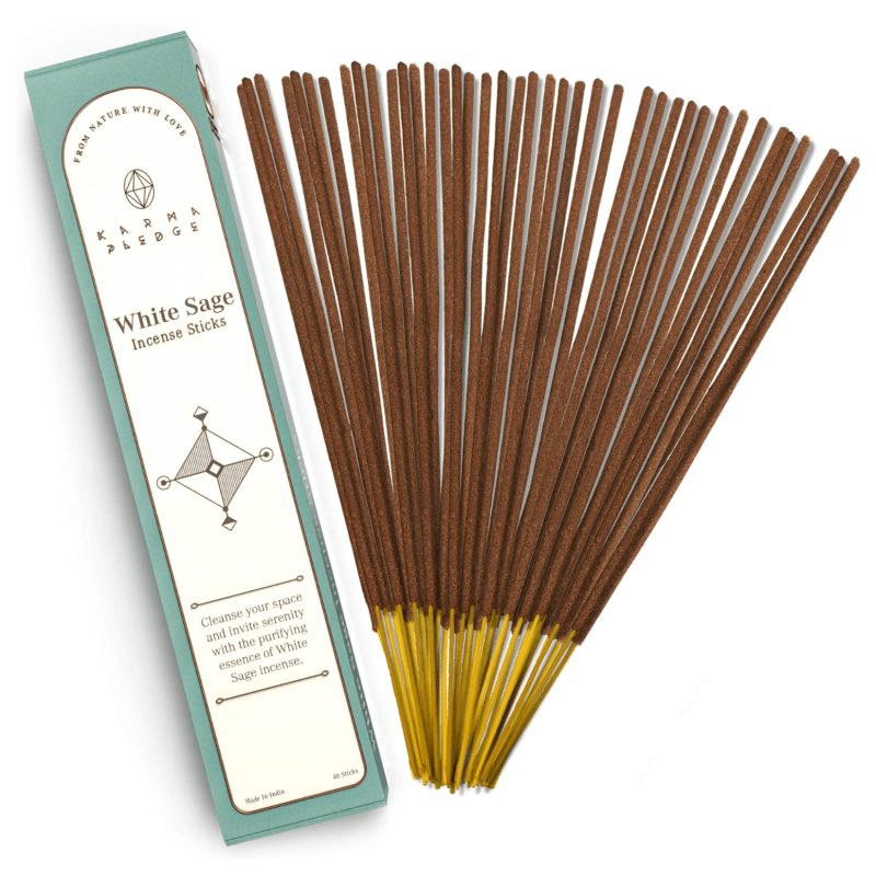 A fanned-out bundle of incense sticks next to their packaging