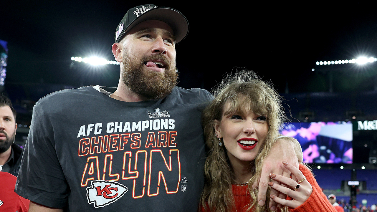 Travis Kelce #87 of the Kansas City Chiefs celebrates with Taylor Swift after a 17-10 victory against the Baltimore Ravens in the AFC Championship Game at M&T Bank Stadium on January 28, 2024 in Baltimore, Maryland.
