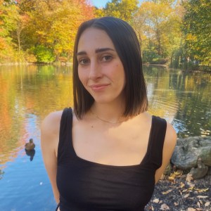 Tara Larson standing in front of a landscape