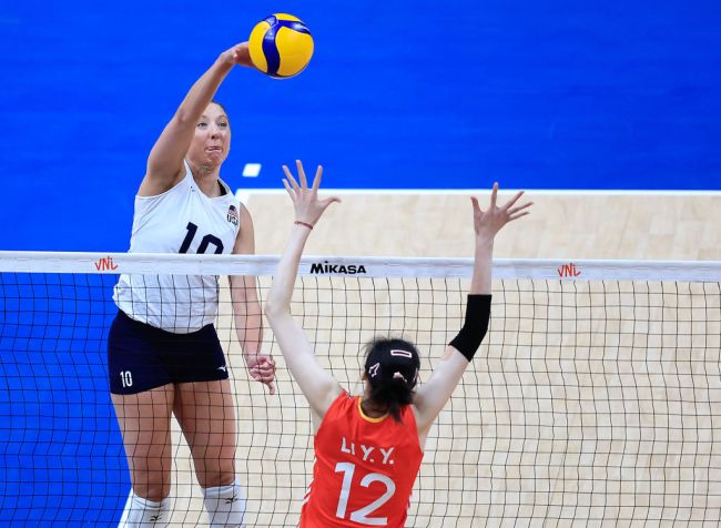 Jordan Larson of the United States jumps to spike the ball against Li Yingying of China during Pool 2 match between China and United States as part of the Women's Volleyball Nations League 2024 on May 16, 2024 in Rio de Janeiro, Brazil.