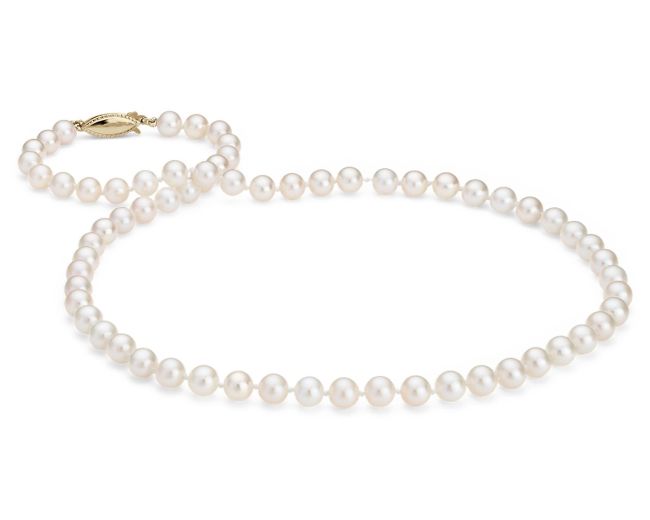 A strand of white pearl beads with a gold clasp