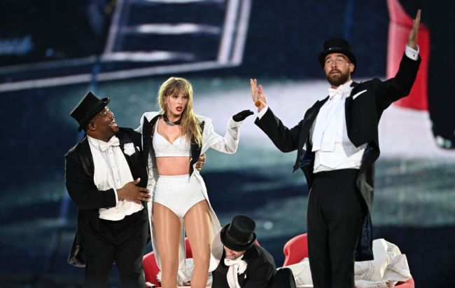 LONDON, ENGLAND - JUNE 23: Taylor Swift is joined on stage by Travis Kelce (R), during "Taylor Swift | The Eras Tour" at Wembley Stadium on June 23, 2024 in London, England.