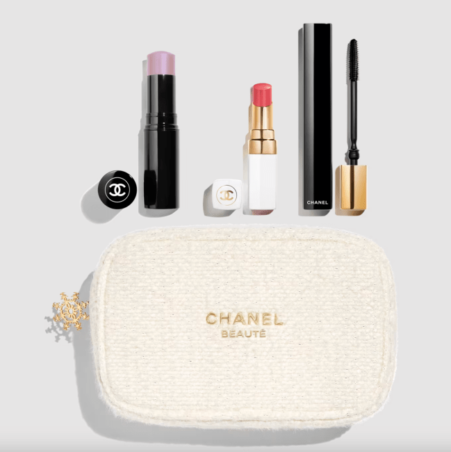 A Chanel makeup bag and three poducts.