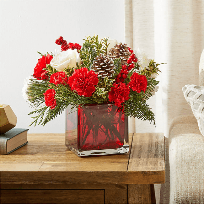 The FTD Christmas Market Bouquet sitting on a wooden table