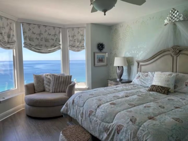 A bedroom with an ocean view