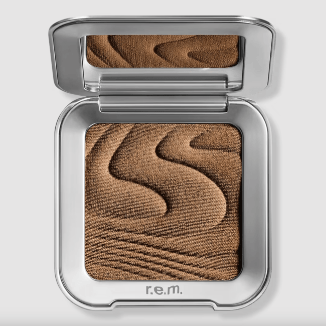 R.e.m. Beauty Hypernova Satin Matte Bronzer in a silver compact.