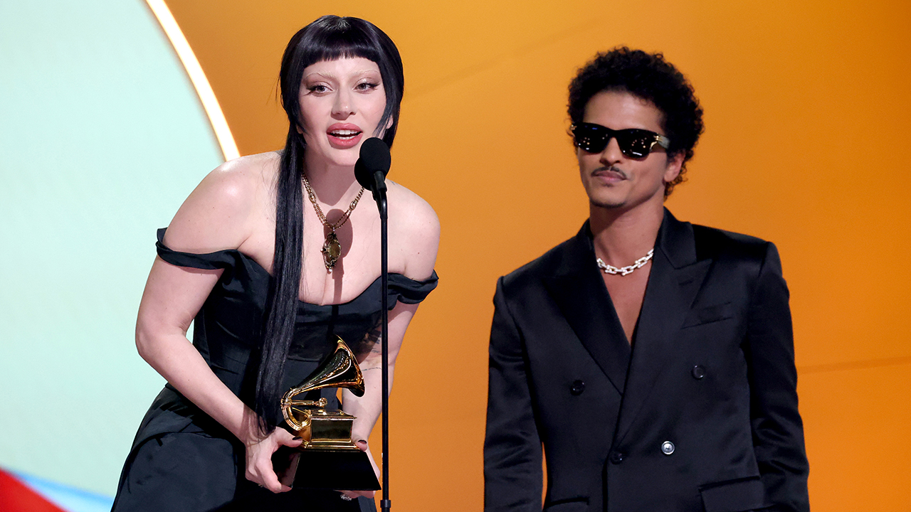 LOS ANGELES, CALIFORNIA - FEBRUARY 02: (L-R) Lady Gaga and Bruno Mars accept the Best Pop Duo/Group Performance Award for "Die with a Smile" onstage during the 67th Annual GRAMMY Awards at Crypto.com Arena on February 02, 2025 in Los Angeles, California.