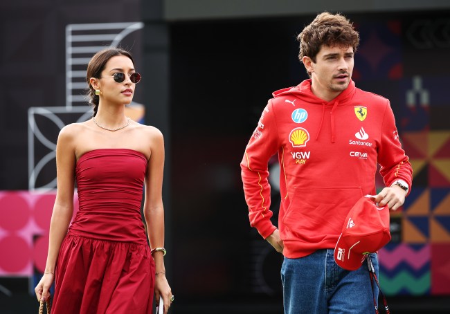 MEXICO CITY, MEXICO - OCTOBER 27: Charles Leclerc of Monaco and Ferrari and Alexandra Saint Mleux walk in the Paddock prior to the F1 Grand Prix of Mexico at Autodromo Hermanos Rodriguez on October 27, 2024 in Mexico City, Mexico.