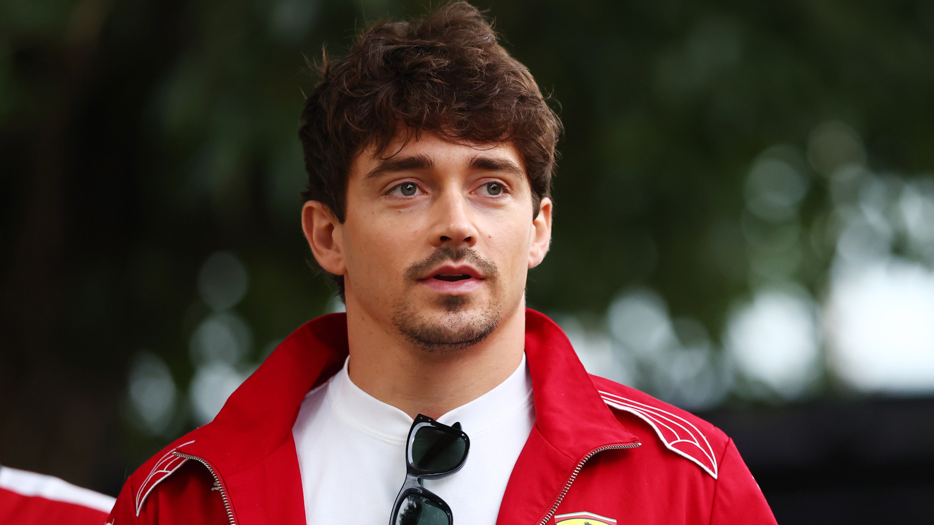MELBOURNE, AUSTRALIA - MARCH 13: Charles Leclerc of Monaco and Scuderia Ferrari looks on in the Paddock during previews ahead of the F1 Grand Prix of Australia at Albert Park Grand Prix Circuit on March 13, 2025 in Melbourne, Australia.