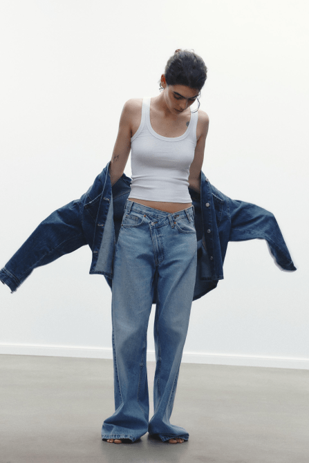 A model wearing the Zara TRF High-Waisted Wide Leg Jeans in a light blue wash