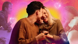 A couple laughing against a colorful background