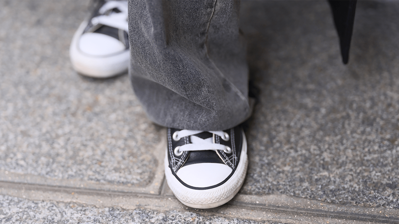 Diane Batoukina wears Converse sneakers / shoes, during a street style fashion photo session, on October 27, 2023 in Paris, France.