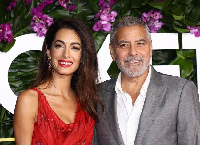 LOS ANGELES, CALIFORNIA - OCTOBER 17: (L-R) Amal Clooney and George Clooney attend the premiere of Universal Pictures' "Ticket To Paradise" at Regency Village Theatre on October 17, 2022 in Los Angeles, California.