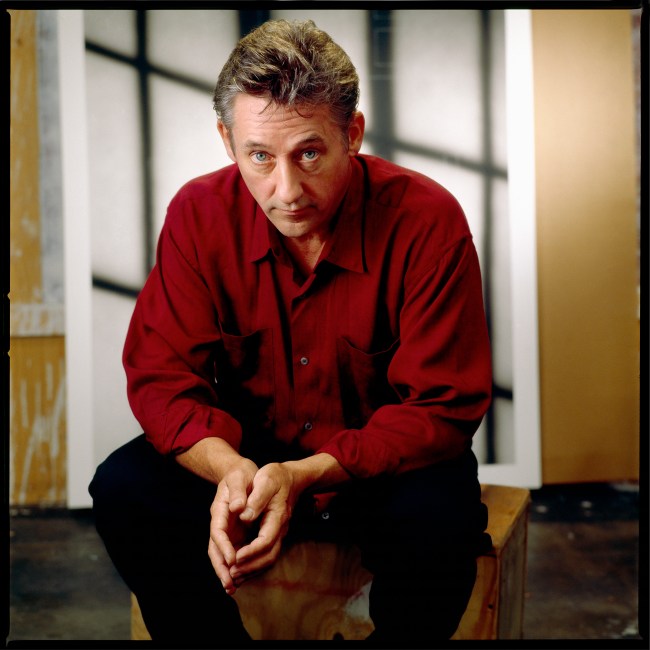 Portrait of American Artist Edward Ruscha wears a red collared shirt and stares at camera in Los Angeles in 1985.